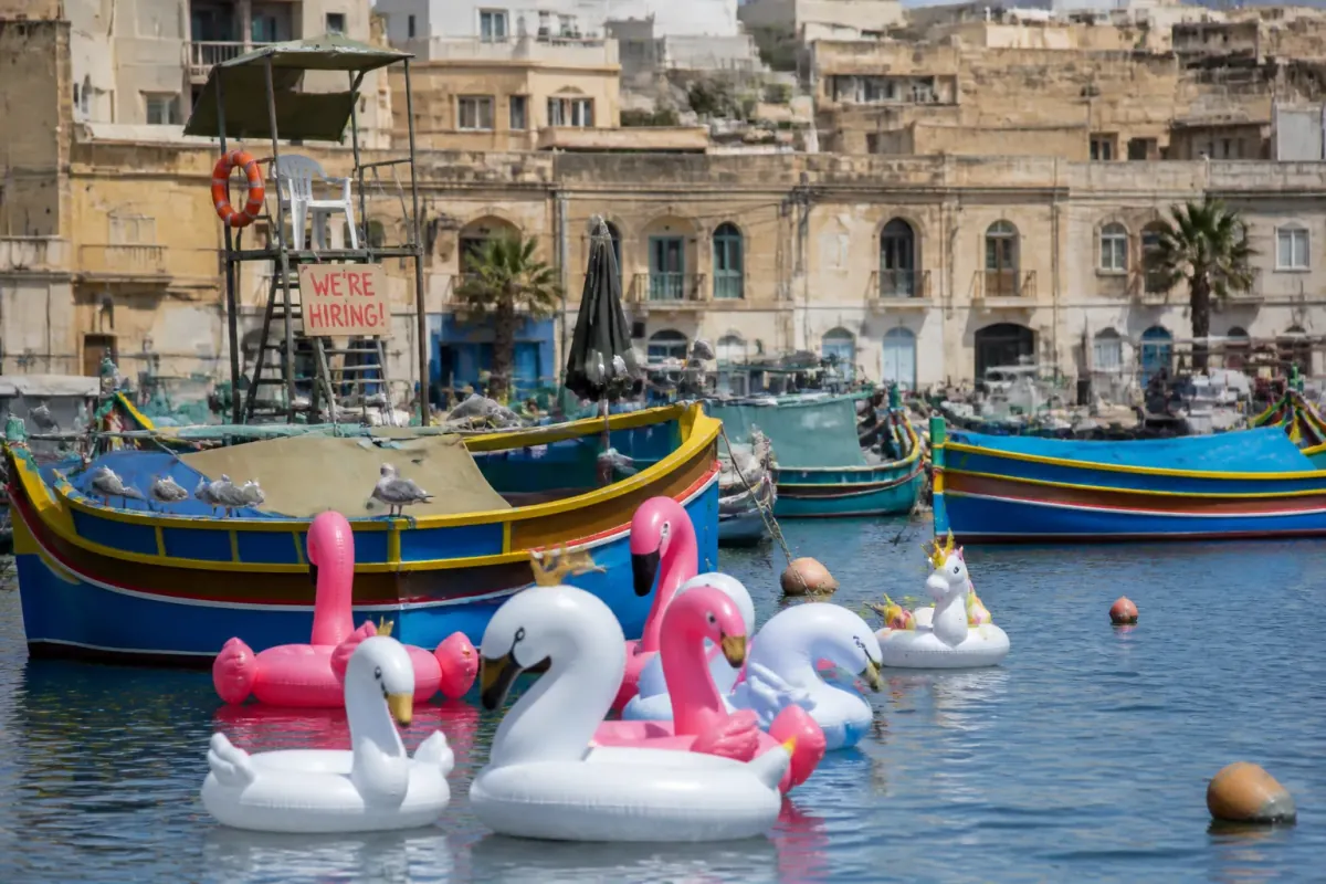 Malta Replaces Il-Luzzu with Inflatable Swans, Seagulls Apply for Lifeguard Jobs